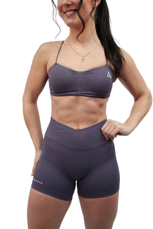NOXVIA Ash Taupe gym set, front view showing the ruched sports bra, high-rise crossover sculpt shorts and NOXVIA branding
