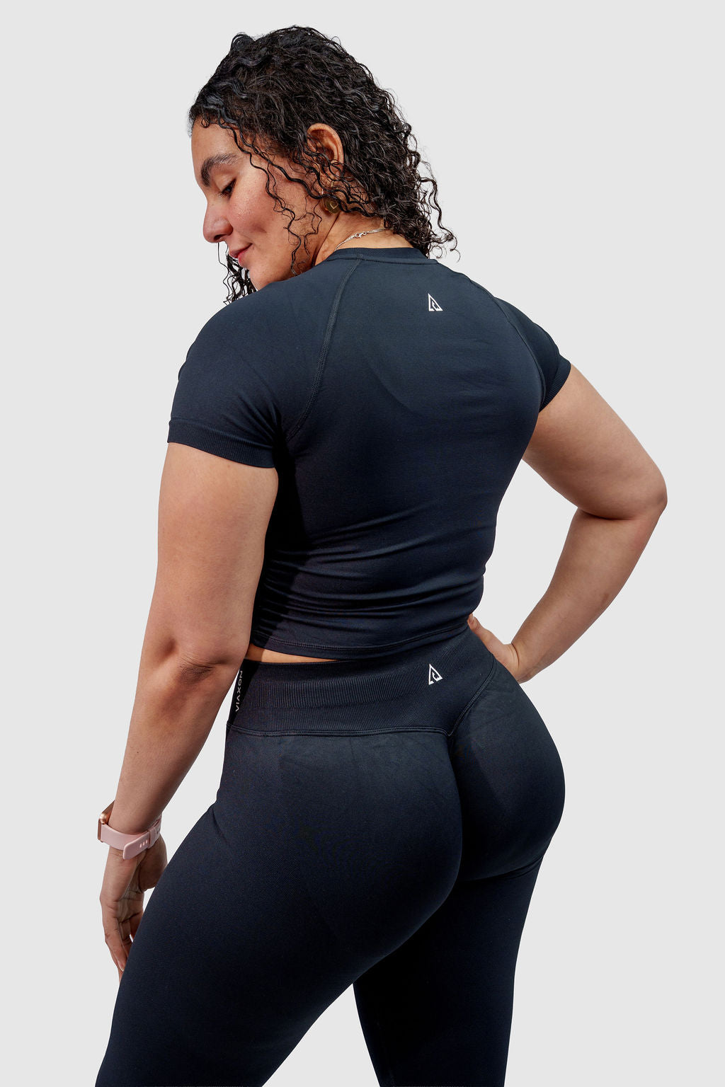 NOXVIA black sculpt leggings, full back-side view showing the high-rise waistband, rear contour shaping and NOXVIA branding
