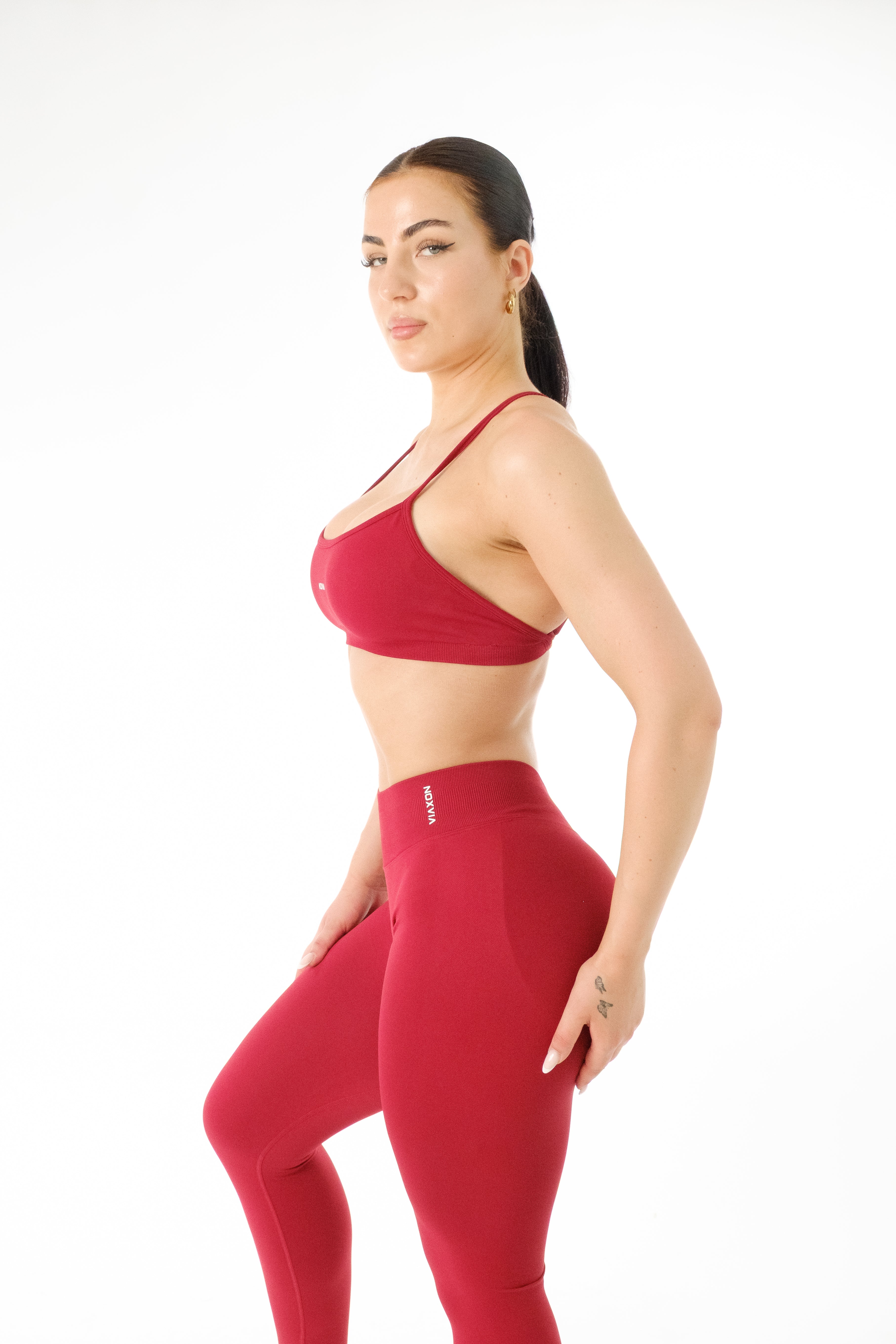 NOXVIA NOVA Cherry women's crossback sports bra with matching leggings, side view