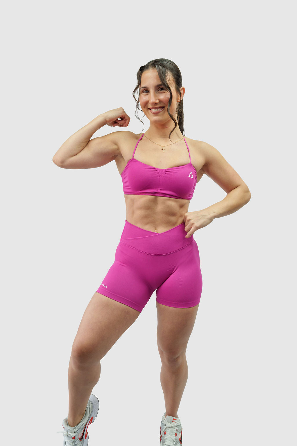 NOXVIA Nova Pink gym set, full front view showing the ruched sports bra, high-rise crossover sculpt shorts and NOXVIA branding
