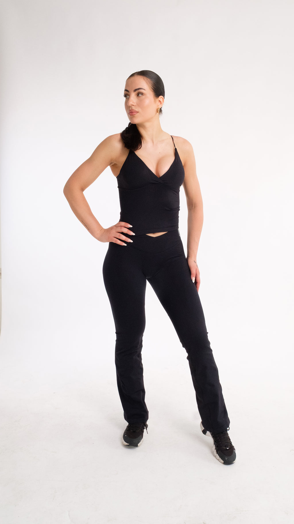 NOXVIA NOVA Sculpt Flare Leggings in Midnight Black with high-rise crossover waistband and full-length flared fit